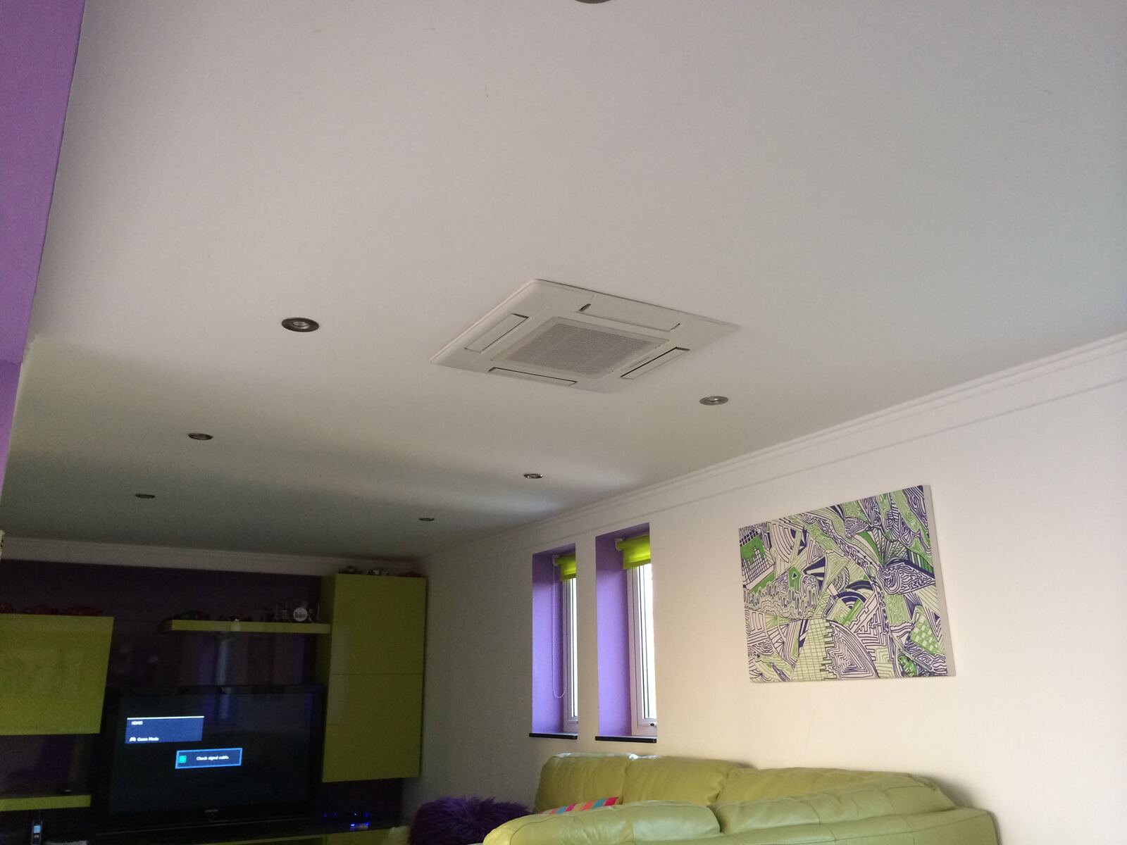 Mitsubishi ceiling cassette air conditioning installed by KSR in a living room