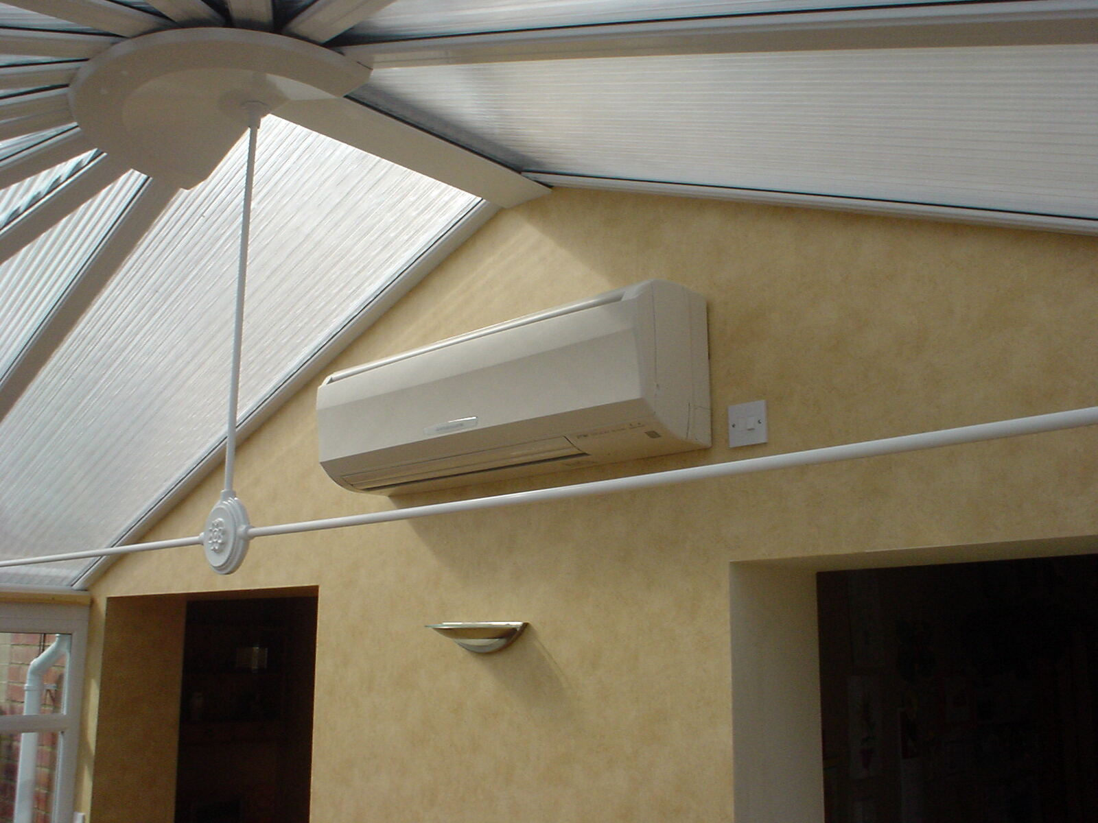 Mitsubishi wall mounted air conditioning unit in a conservatory