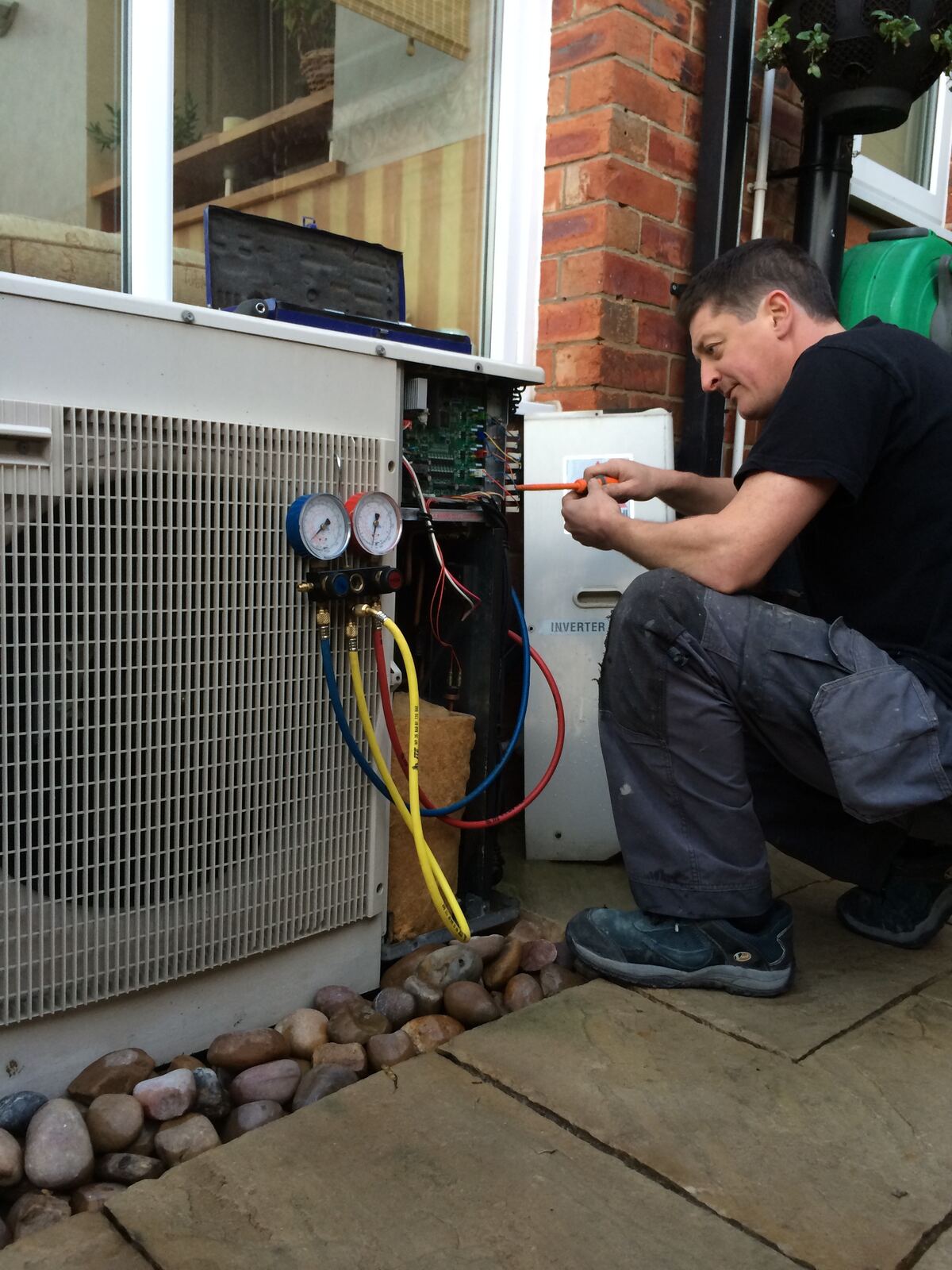 KSR engineer commissioning an outdoor heat pump unit